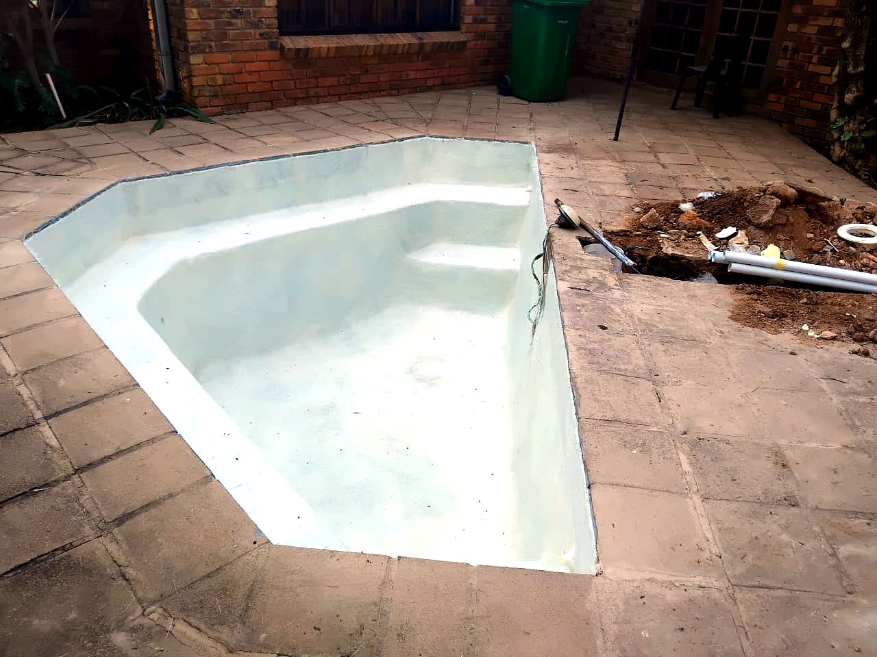 Freshly resurfaced pool in vivid blue