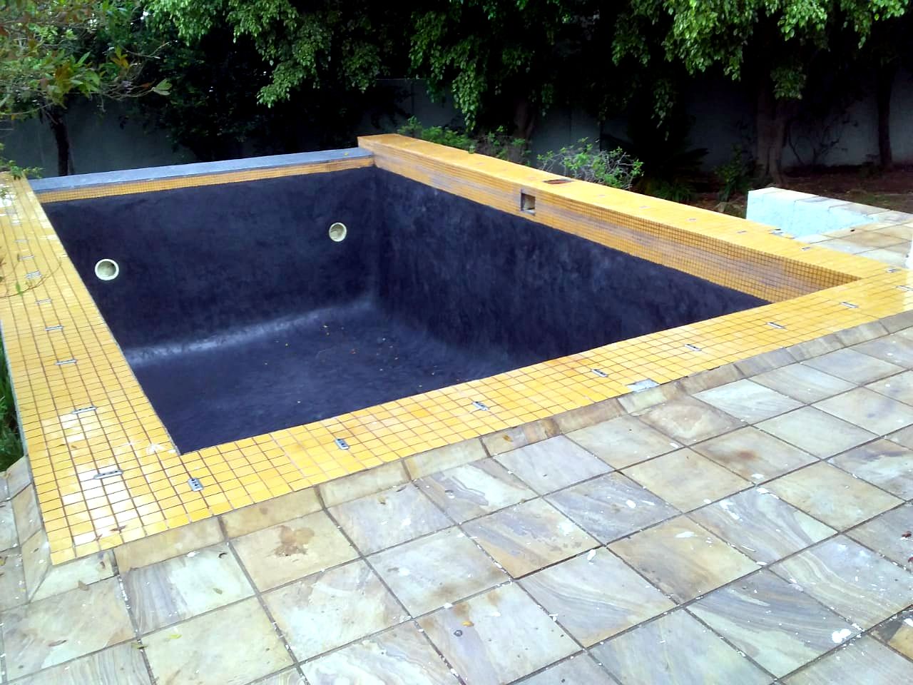 Charcoal marblelite pool with yellow tile border